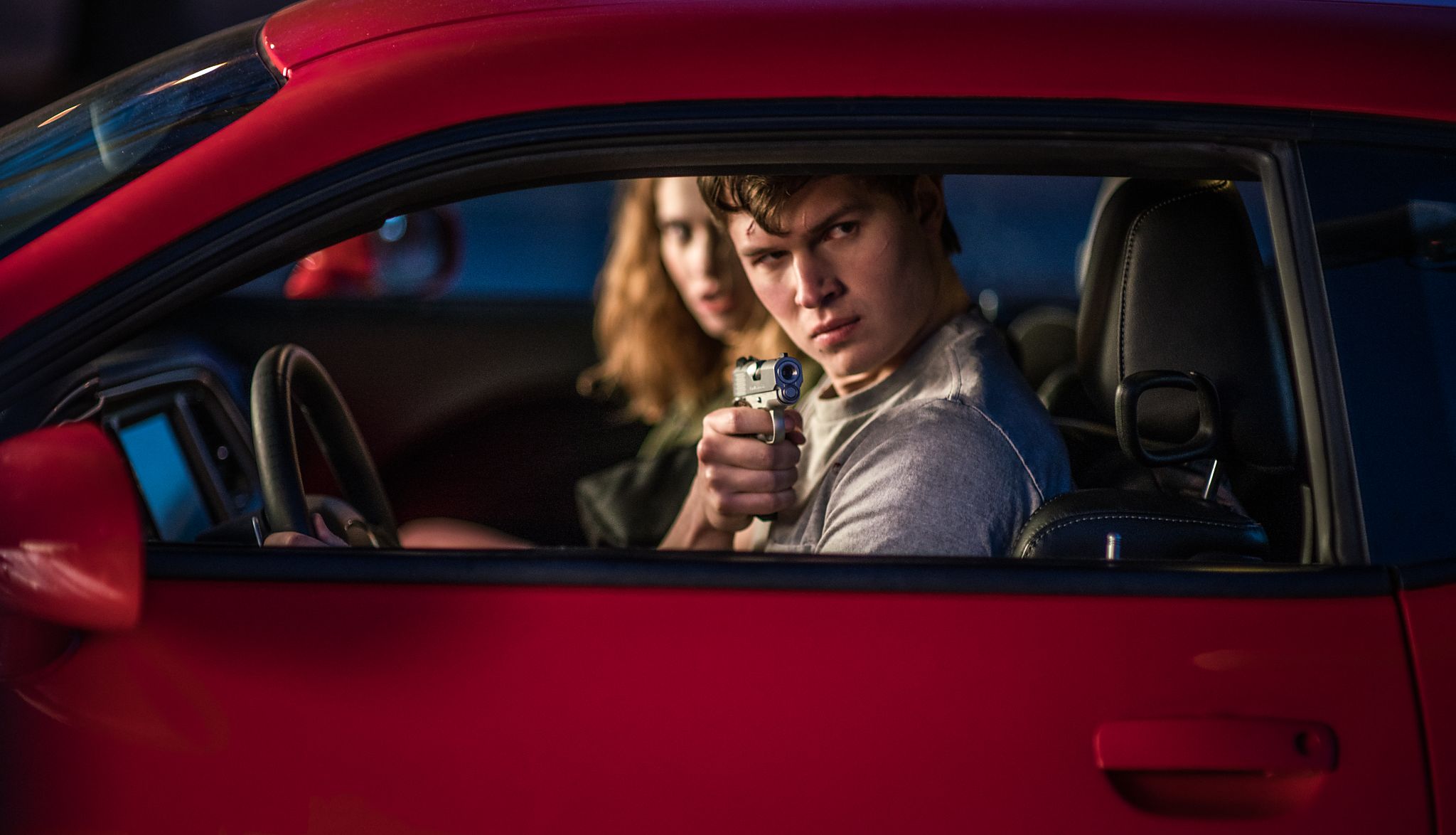 Lily James (background) and Ansel Elgort