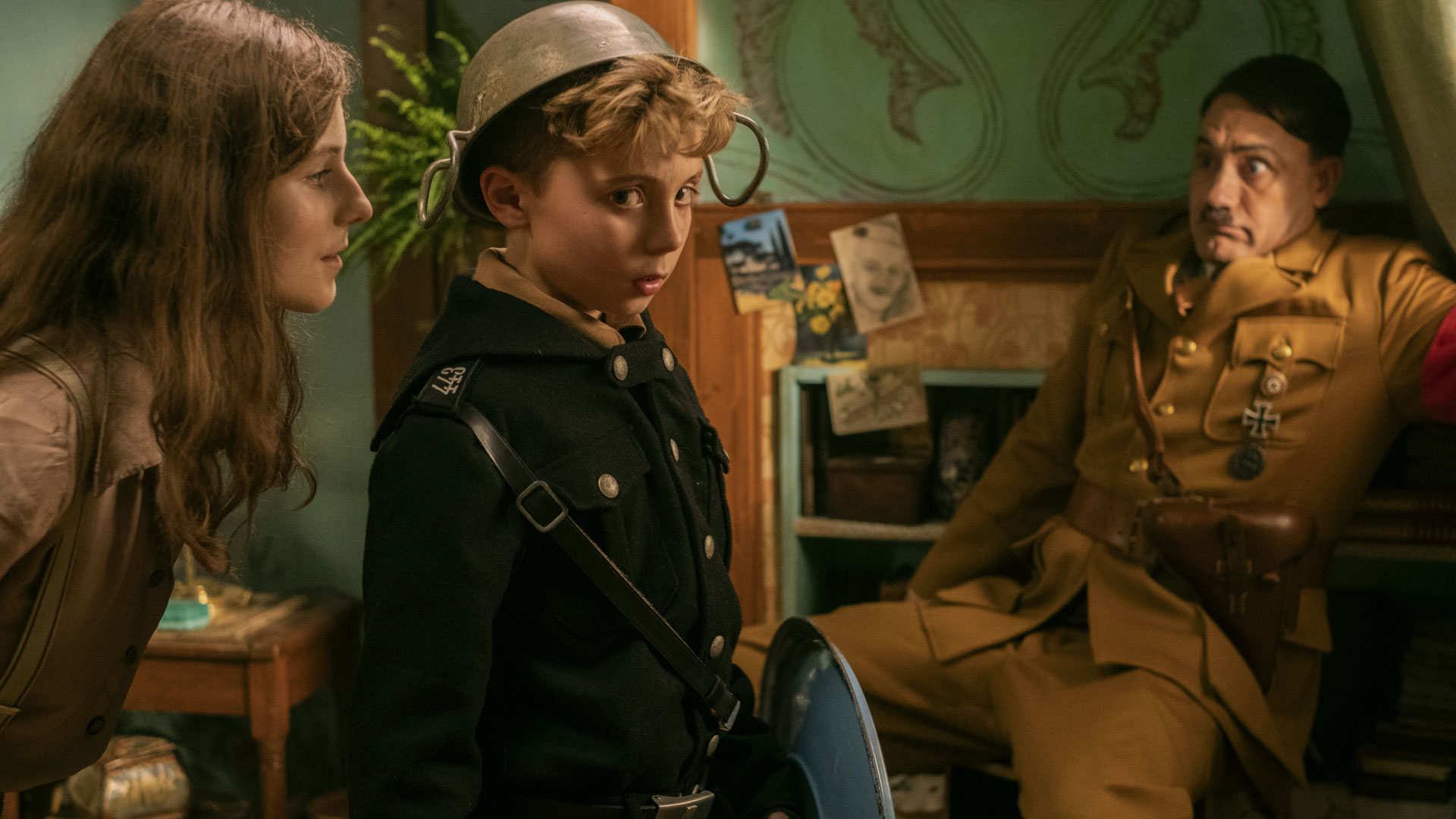 Thomasin McKenzie, Roman Griffin Davis and Taika Waititi in Jojo Rabbit.